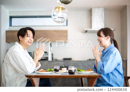 A young Japanese couple enjoying a holiday lunch 124400638