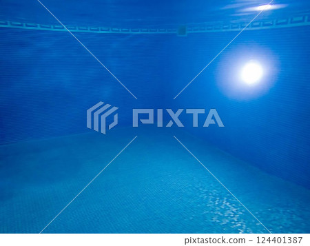 Underwater view of blue mosaic swimming pool interior light skimmer copy space Underwater view of blue mosaic swimming pool interior light skimmer copy space 124401387