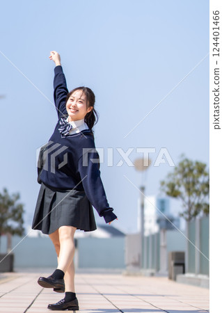 High school girls dancing energetically under the refreshing blue sky 124401466
