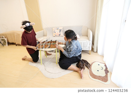 Playing Foosball Game 124403236