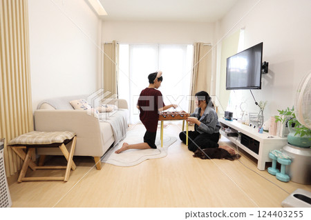 Playing Foosball Game 124403255