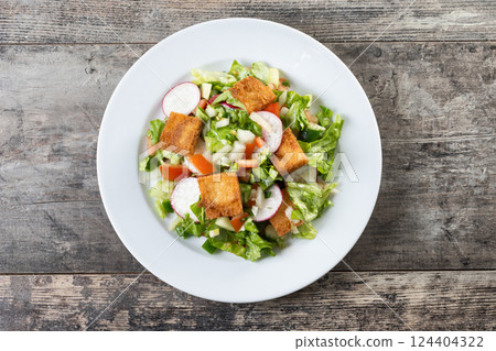 Fattoush salad, Traditional Lebanese Salad on wooden table 124404322