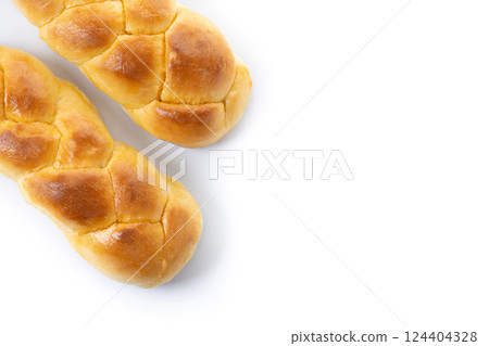 Traditional Easter braided bread. Tsoureki braid isolated on white background Traditional Easter braided bread. Tsoureki braid isolated on white background 124404328