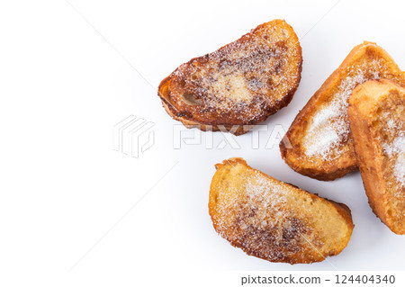 Traditional Spanish torrijas for Holy Week isolated on white background. Traditional Spanish torrijas for Holy Week isolated on white background. 124404340