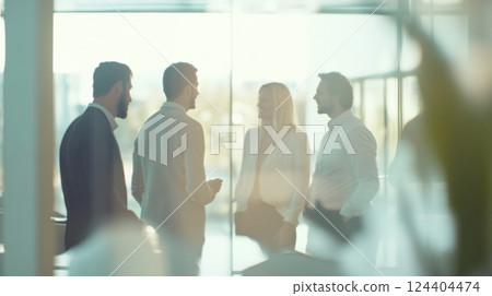 People in a business meeting enjoying a conversation People in a business meeting enjoying a conversation 124404474