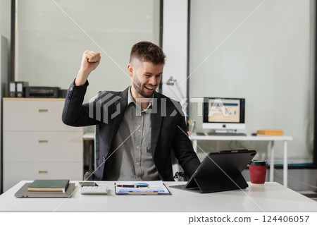 Successful businessman male on computer, happy smiling, getting bonus money 124406057