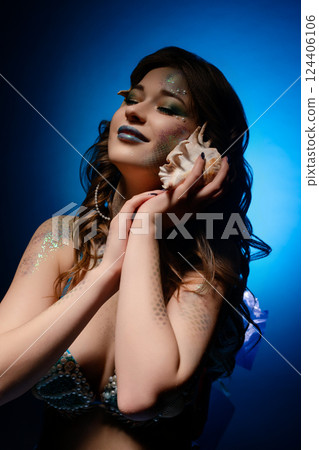 Elegant mermaid cosplay with vibrant body art and creativity Elegant mermaid cosplay with vibrant body art and creativity 124406106