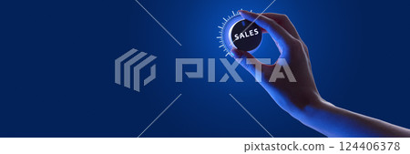 Person adjusting glowing dial labeled SALES against dark background in neon, optimization of sales performance. Person adjusting glowing dial labeled SALES against dark background in neon, optimization of sales performance. 124406378