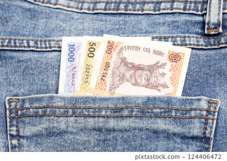 Moldovan Leu in the pocket of blue jeans 124406472