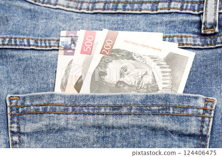 Slovenian Tolar in the pocket of blue jeans Slovenian Tolar in the pocket of blue jeans 124406475