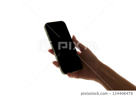 Hand holding smartphone with blank, dark screen against white background. Mockup. Ads, design 124406478