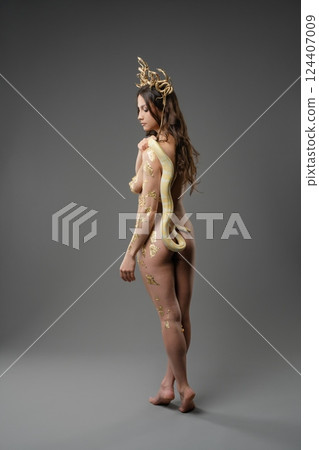 Beauty in motion with elegant body art and nature-inspired adornments Beauty in motion with elegant body art and nature-inspired adornments 124407009