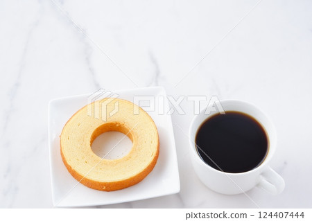 Enjoy delicious Baumkuchen and freshly brewed coffee for a perfect coffee break. Enjoy delicious Baumkuchen and freshly brewed coffee for a perfect coffee break. 124407444