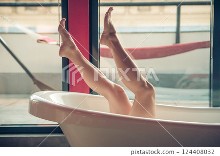 Woman feet in bathrobe at home, closeup Woman feet in bathrobe at home, closeup 124408032