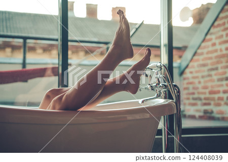 Woman feet in bathrobe at home, closeup 124408039