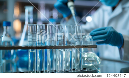 Scientists meticulously conduct titration experiments for precise analytical research results. Scientists meticulously conduct titration experiments for precise analytical research results. 124408347