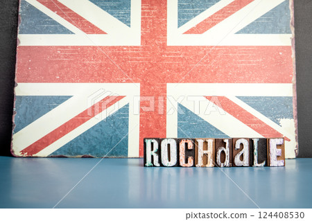 ROCHDALE. Urban Area in Great Britain. Flag and alphabet letters on wooden texture background 124408530