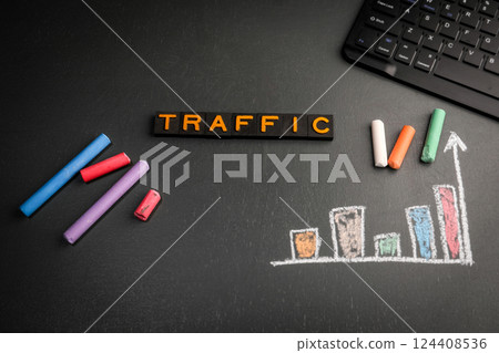 Traffic. Text from old alphabet letters. Computer keyboard on the table Traffic. Text from old alphabet letters. Computer keyboard on the table 124408536