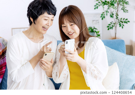 Parents and children look at smartphones Parents and children look at smartphones 124408654