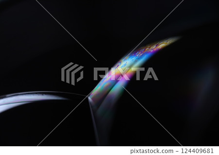 Bright liquid line on black background, phenomenal rainbow reflection, beautiful physical effects Bright liquid line on black background, phenomenal rainbow reflection, beautiful physical effects 124409681