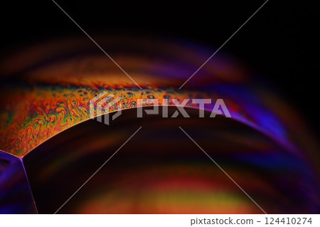 Bright orange and purple liquid surface, orange and purple fluid forms, liquid abstraction, colour surfaces, deep dark backgrounds, physical shapes 124410274