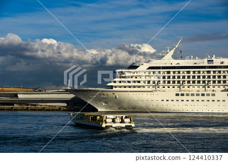 Yokohama Port New Port with a luxury cruise ship anchored on a sunny day 124410337