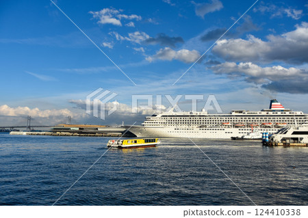 Yokohama Port New Port with a luxury cruise ship anchored on a sunny day 124410338