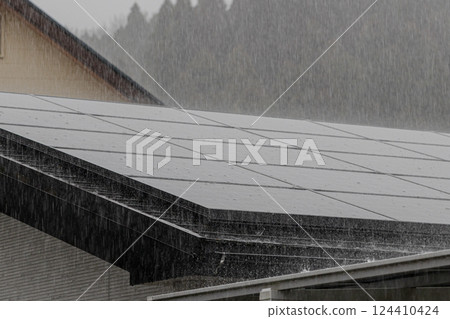 Heavy rain pounding solar panels 124410424