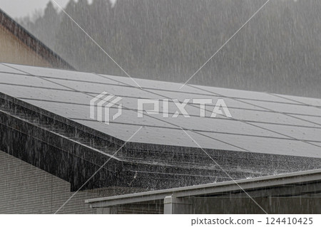 Heavy rain pounding solar panels 124410425