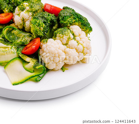 Fresh vegetables on a white plate with colorful display 124411643