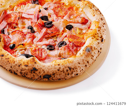 Freshly baked pizza with toppings on wooden plate 124411679