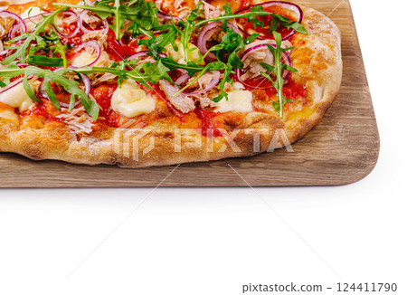 Fresh gourmet pizza with arugula on wooden board Fresh gourmet pizza with arugula on wooden board 124411790