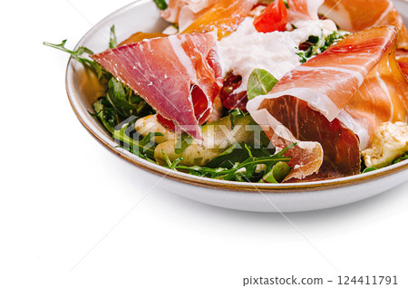 Fresh prosciutto and arugula salad bowl 124411791