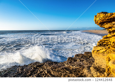 Big waves near the lighthouse at Praia do Norte, Nazare, Portugal Big waves near the lighthouse at Praia do Norte, Nazare, Portugal 124412648