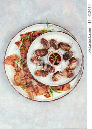 Gourmet bacon wrapped dates 124412684