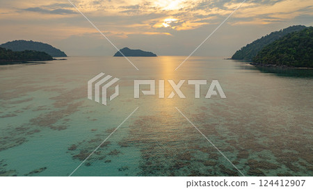 aerial view of stunning sunset above Ko Pachumba Surin Islands 124412907