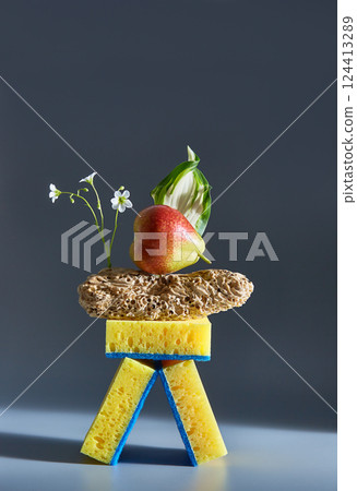 Creative composition of food, sponges, wood and flowers. Advertisement idea. Minimal nature concept. Clean and health concept. Creative composition of food, sponges, wood and flowers. Advertisement idea. Minimal nature concept. Clean and health concept. 124413289