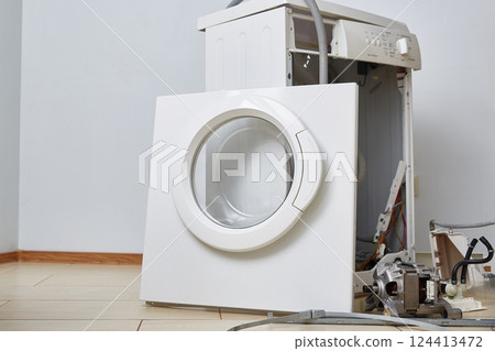 Washing machine repair. Disassembled washing machine. Close-up. Copy space. 124413472
