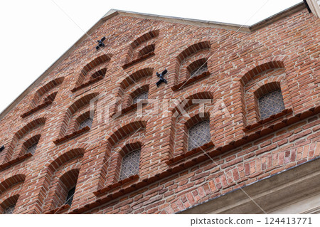 Medieval Brick Facade with Arched Windows Medieval Brick Facade with Arched Windows 124413771