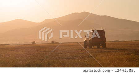 4x4 car on offroad against beautiful sunset ,adventure trail. 124413883