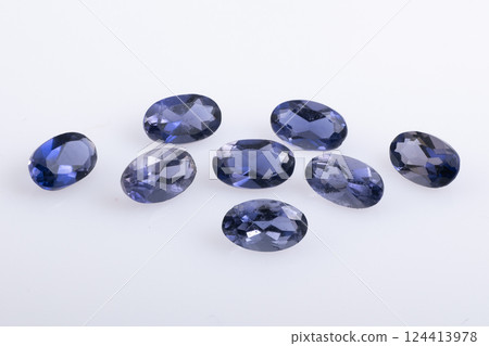 Eight Oval Shaped Faceted Natural Blue Violet Iolite Gemstones On White Background 124413978