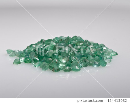 Precise Pile of Radiant Natural Green Emerald Loose Gemstones Isolated on White Background Precise Pile of Radiant Natural Green Emerald Loose Gemstones Isolated on White Background 124413982