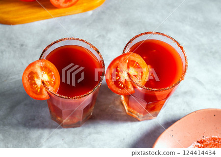 Top view shot of two refreshing vegetable cocktails. Red cocktail. Tomato juice served in glass with tomato slice. Image for menu, bars, restaurants 124414434
