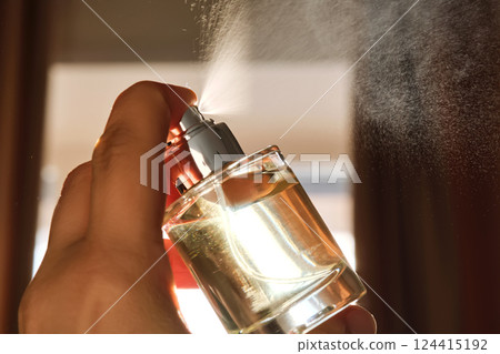 Spraying perfume against the windows. Spraying perfume against the windows. 124415192