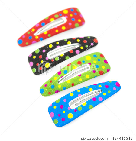 Colored hair clips isolated on white background. Colored hair clips isolated on white background. 124415513