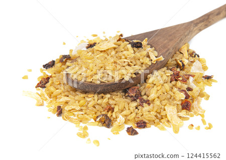Dry bulgur pile in wooden spoon isolated on white background 124415562