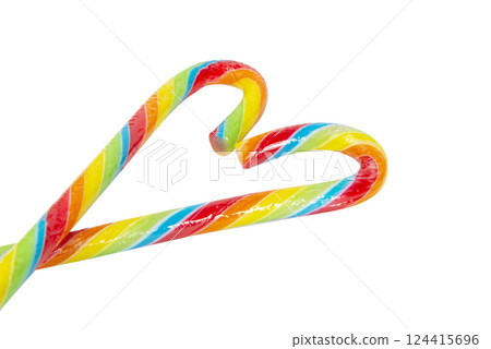 Multicolor stripy candy cane stick isolated on a white background Multicolor stripy candy cane stick isolated on a white background 124415696