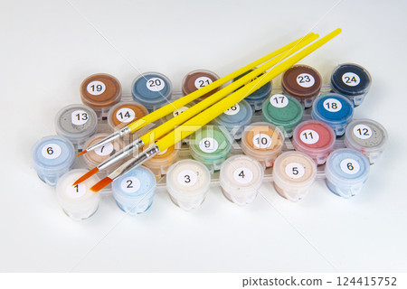Painting by numbers numered bottles with brushes on the white 124415752