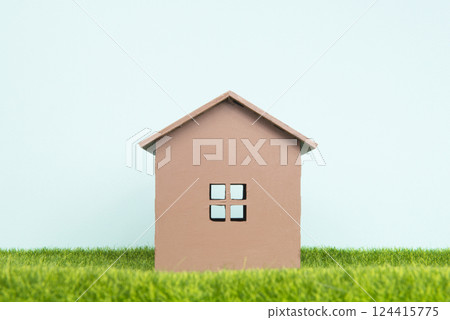 Model house on green grass concept of new building 124415775
