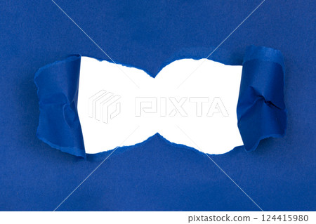 Blue torn sheet of paper with whole space for text 124415980